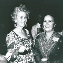Mrs William B Walsh with unknown at SS HOPE reception on the helicop deck.